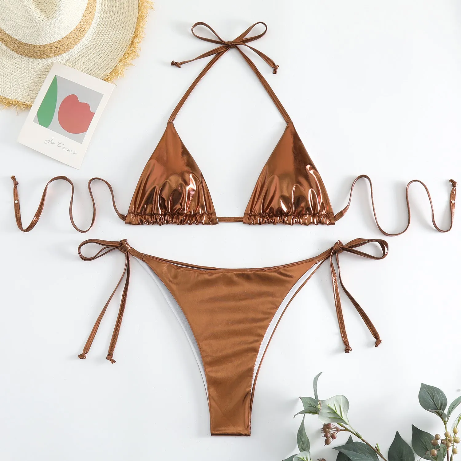 Women's lace-up bikini in metallic colour with adjustable ties and polyester fabric.