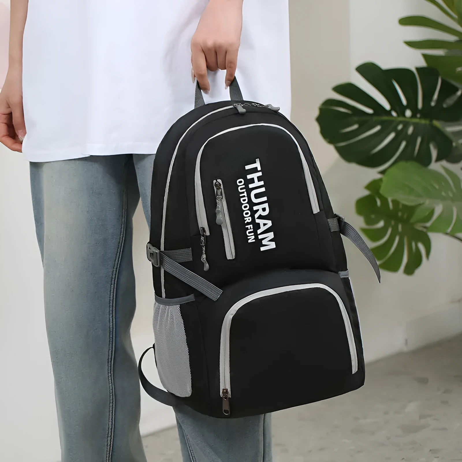 Dark blue folding outdoor backpack with straps, showing its large capacity and air pillow belt.