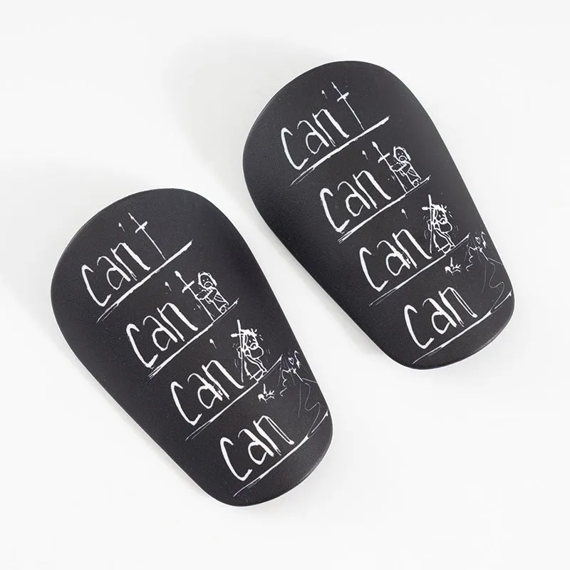 A pair of PU football shin guards in a choice of colours including black, blue, and white.