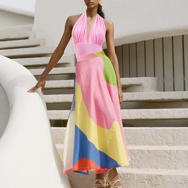 Solid colour women's one-piece swimsuit with deep V halter neck and backless design, shown with matching skirt.
