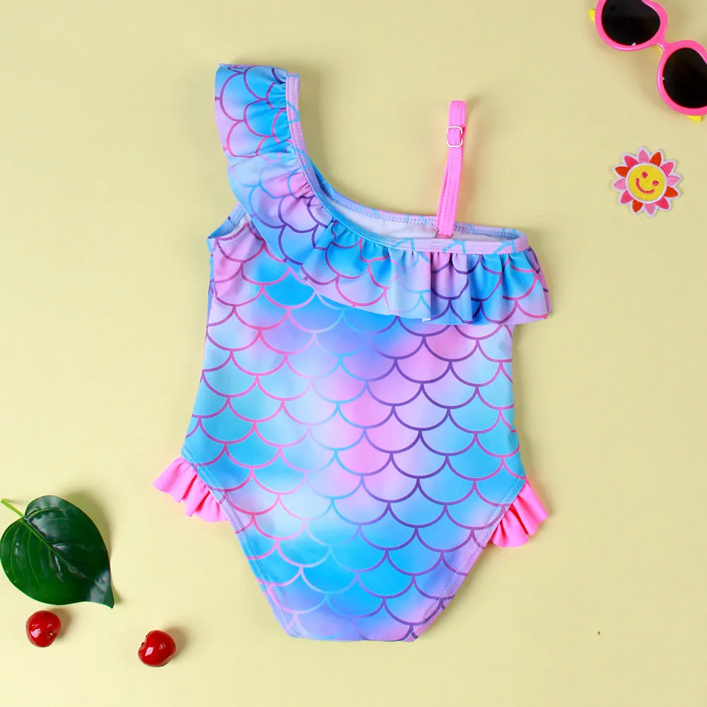 Girls' one-piece swimsuit with cartoon scale print and flounced gradient design in high elasticity nylon.