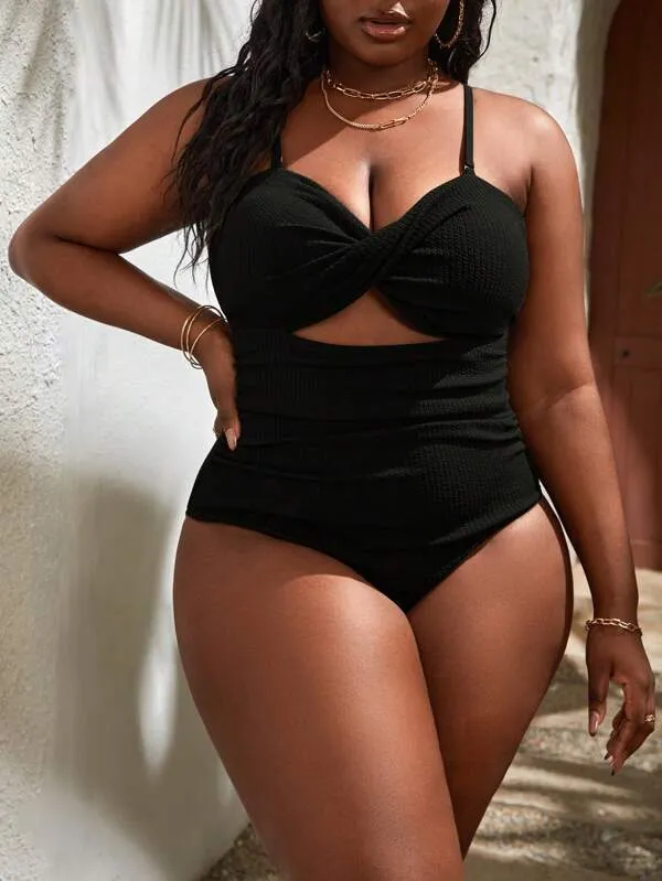 Plus size women's black slimming one-piece swimsuit with triangle sling design