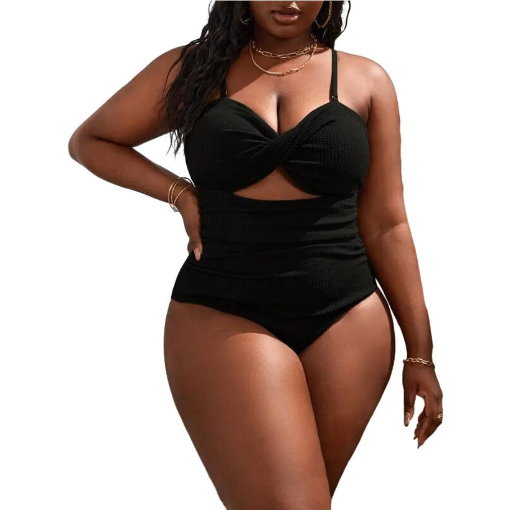 Plus size women's black slimming one-piece swimsuit with triangle sling design