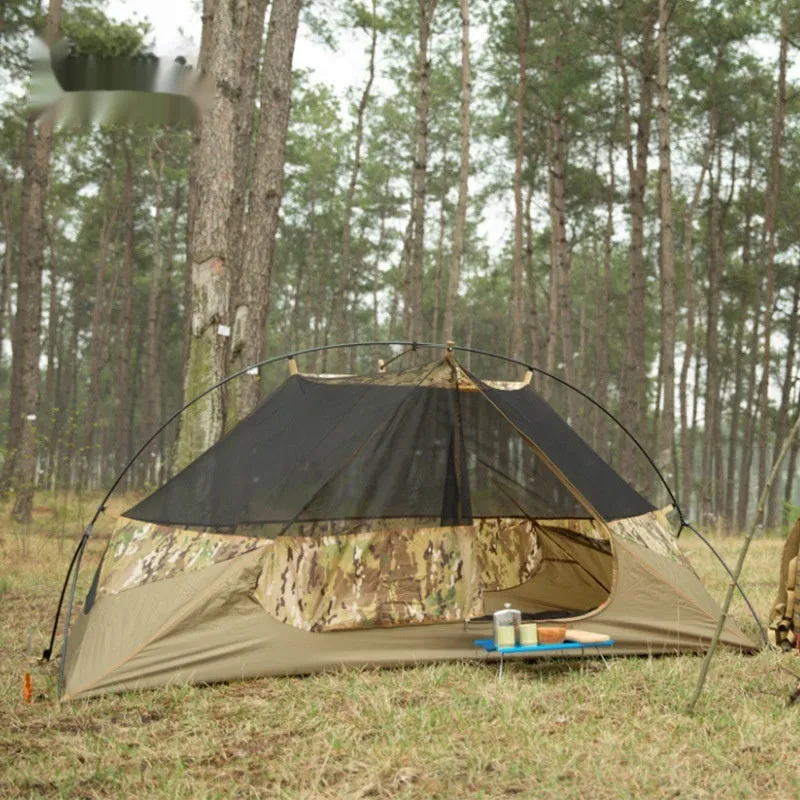 Single soldier camouflage tent shown in outdoor setting with rainproof and sun protection features for camping use