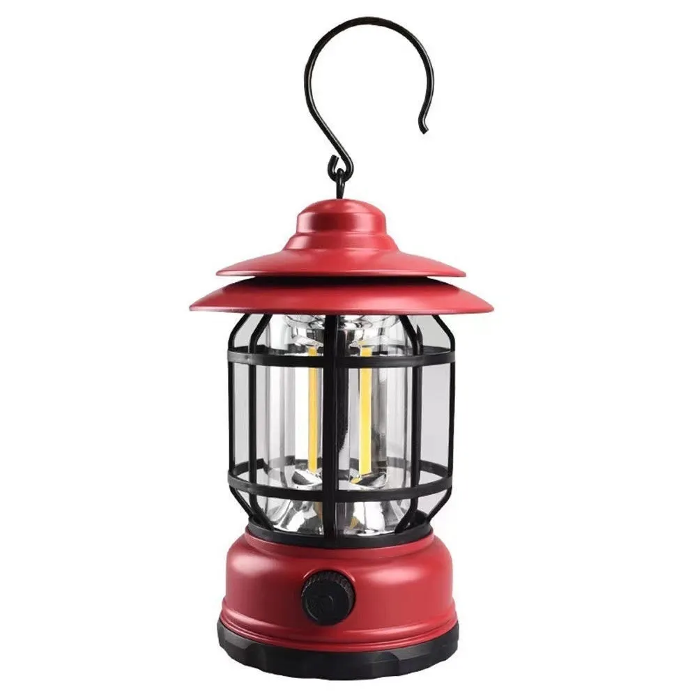 Portable head lamp camping lantern in dark green, showing compact size for hands-free use.