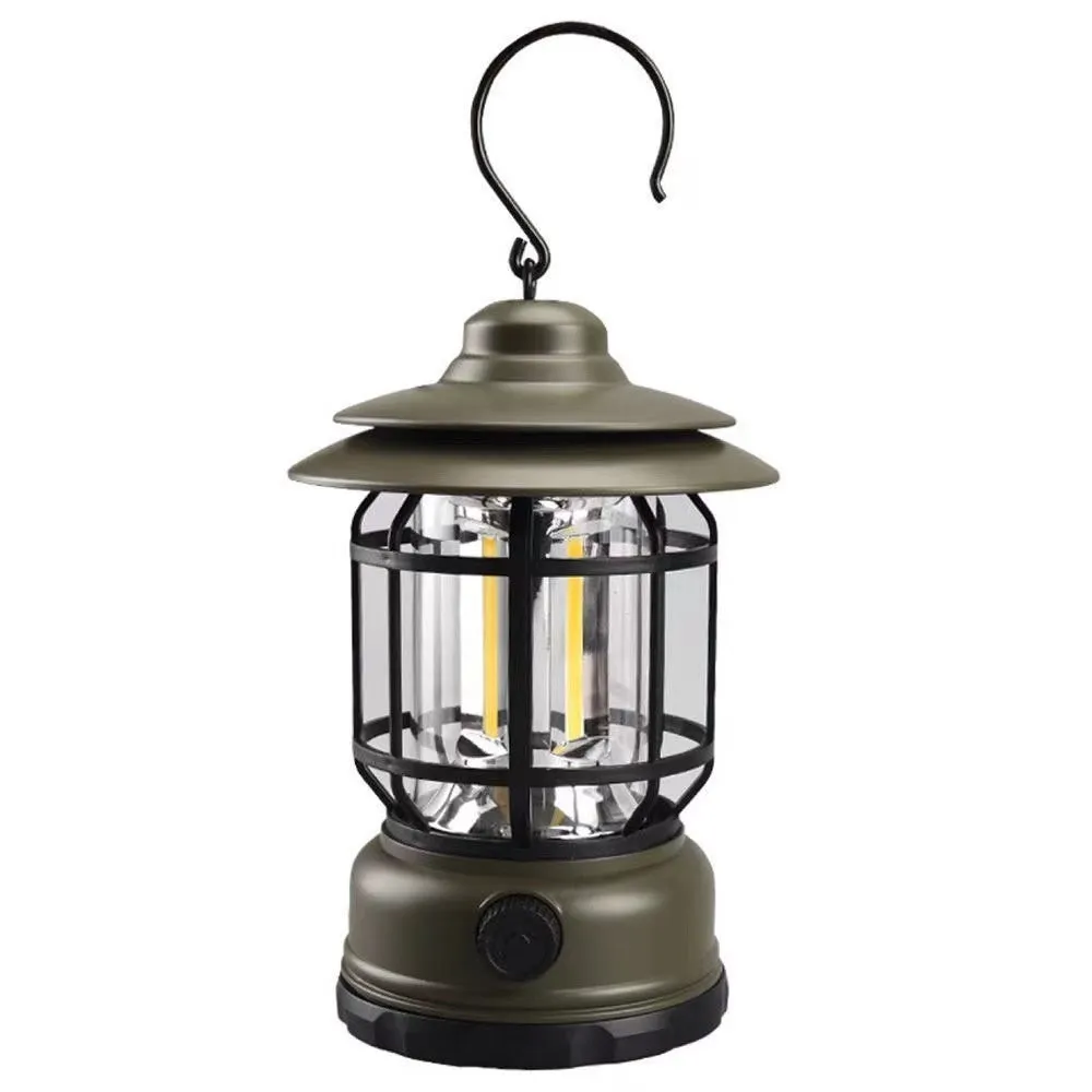 Portable head lamp camping lantern in dark green, showing compact size for hands-free use.
