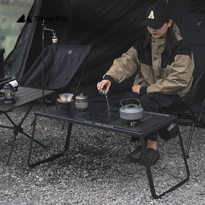 Folding carbon steel camping table with IGT modular system and multiple cell board design options.