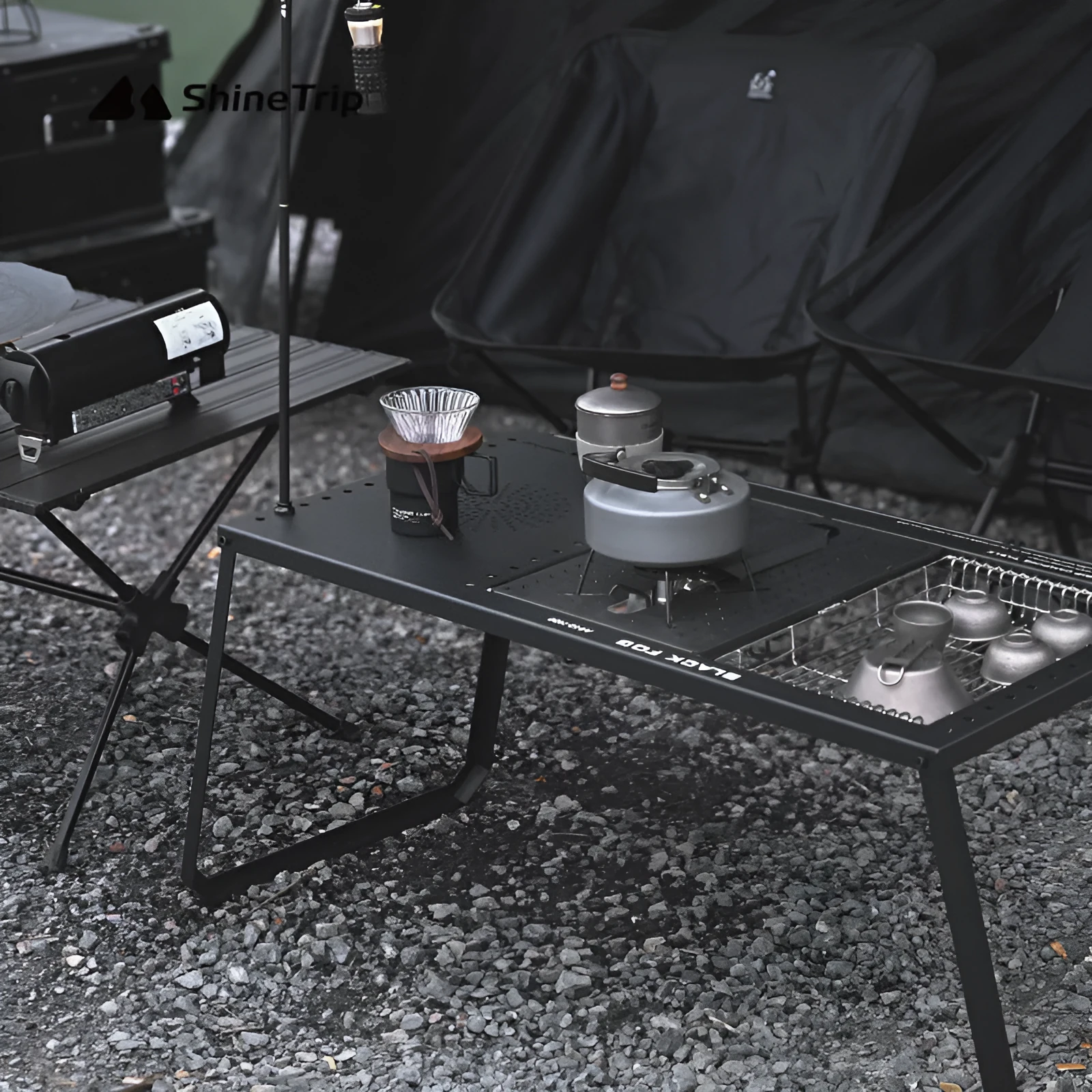 Folding carbon steel camping table with IGT modular system and multiple cell board design options.