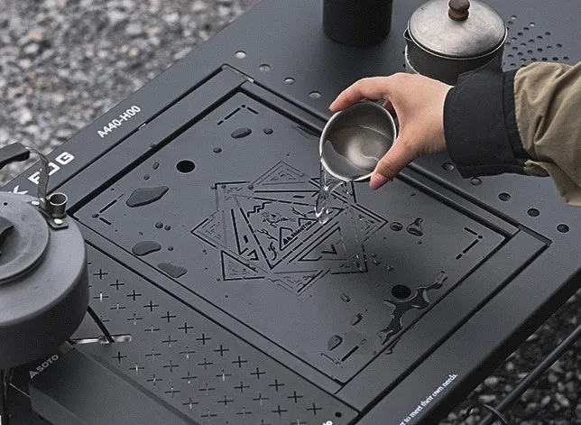 Folding carbon steel camping table with IGT modular system and multiple cell board design options.