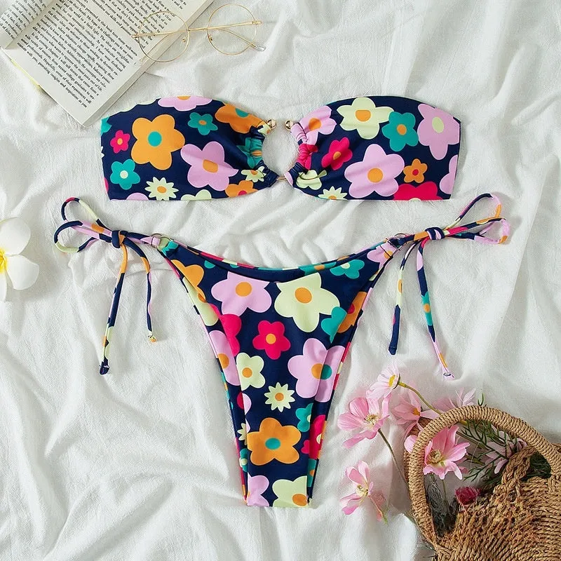 Women's pink polyester bikini set with tube top and briefs on a mannequin