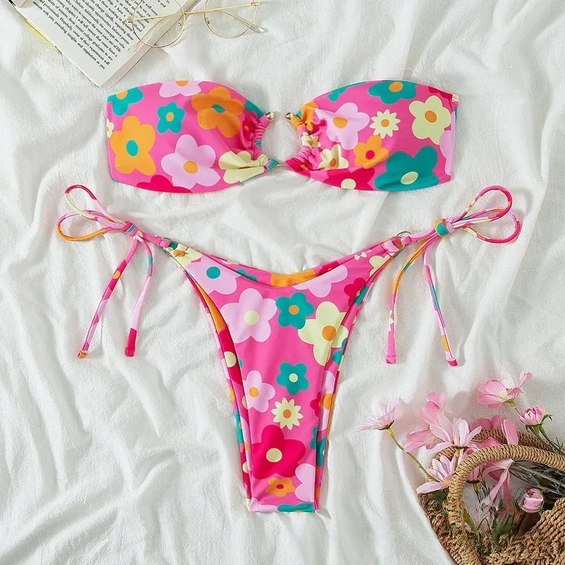 Women's pink polyester bikini set with tube top and briefs on a mannequin
