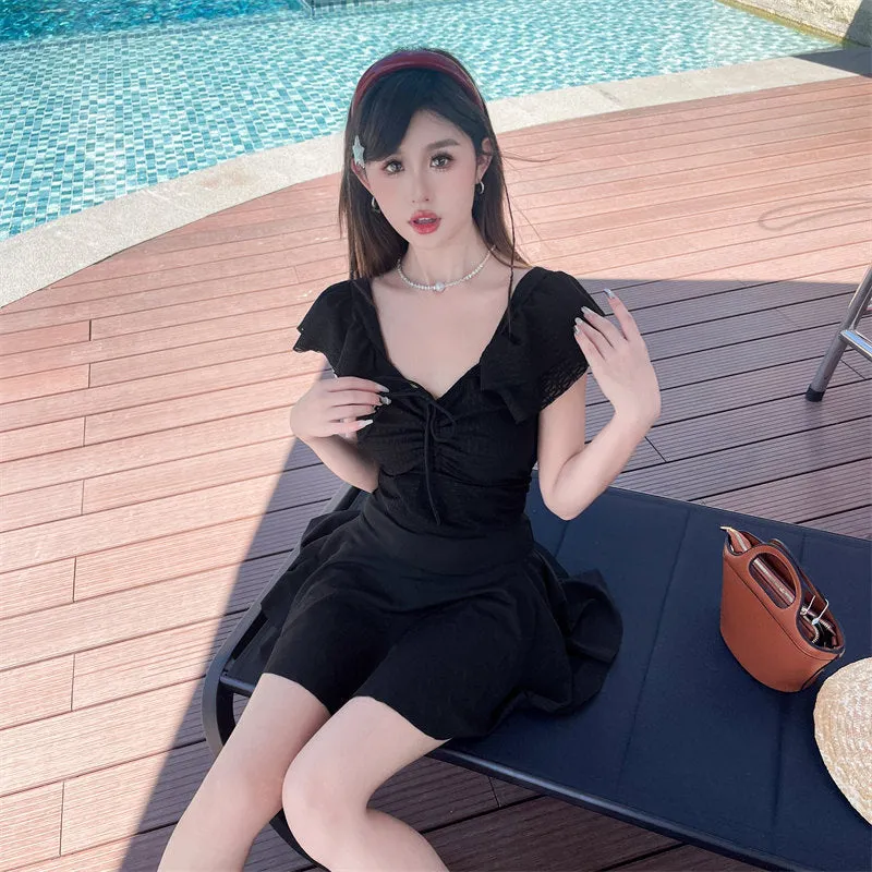 Women's split skirt-style bathing swimsuit in polyester and spandex, black colour, with top and separate skirt