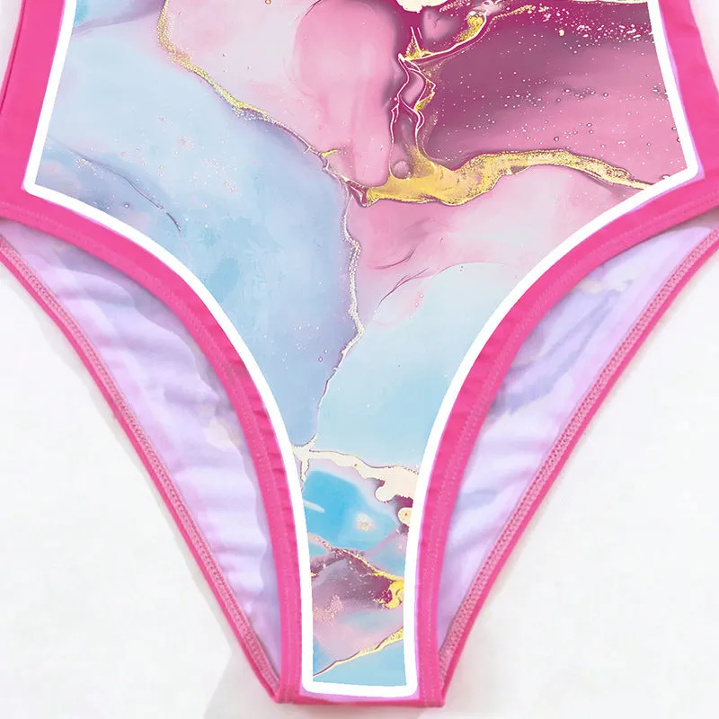 Pink printed women's one-piece swimsuit with a sheath silhouette and attached skirt.