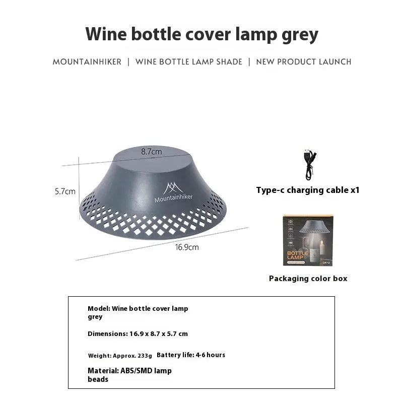 Beige and grey wine bottle-shaped camping lantern showing its compact size and light gear switch.
