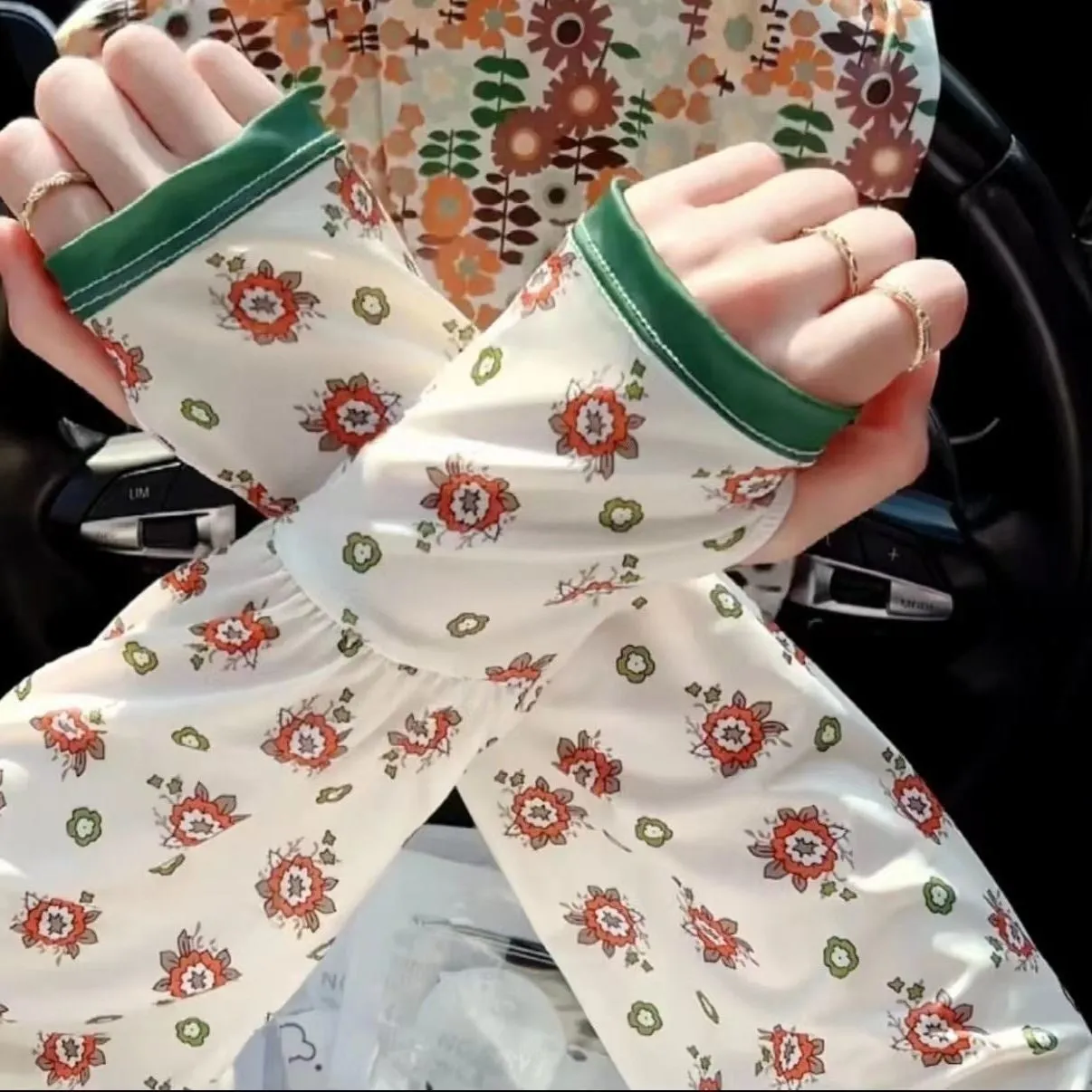 Printed ice silk oversleeve gloves for UV protection in floral and solid colours.