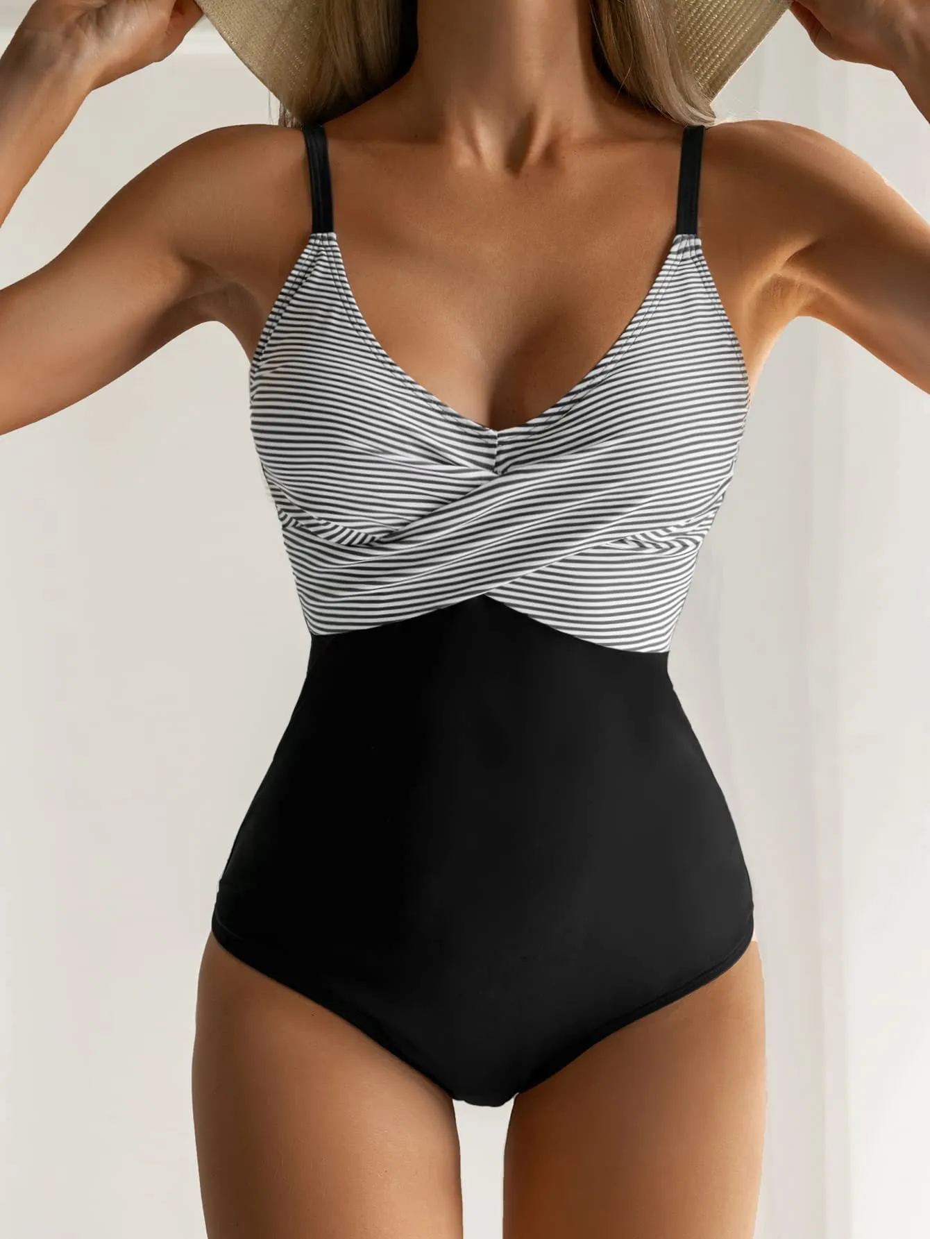 Women's printed one-piece bikini swimsuit with lace-up back detail in a leopard print pattern.