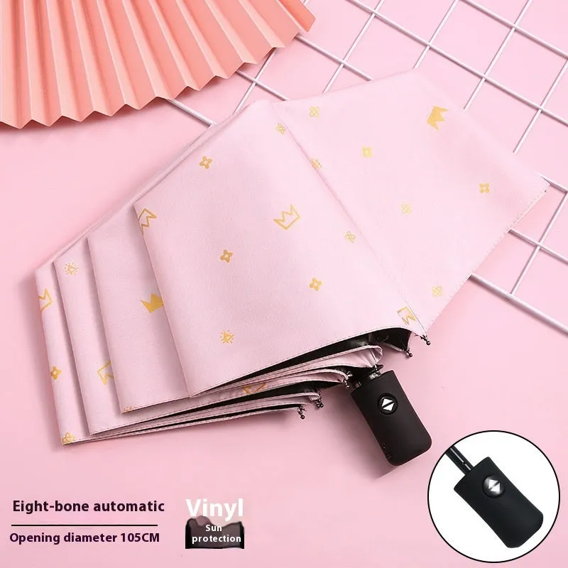Dual-use automatic eight-bone bronzing feather folding umbrella with black rubber handle and NC fabric canopy