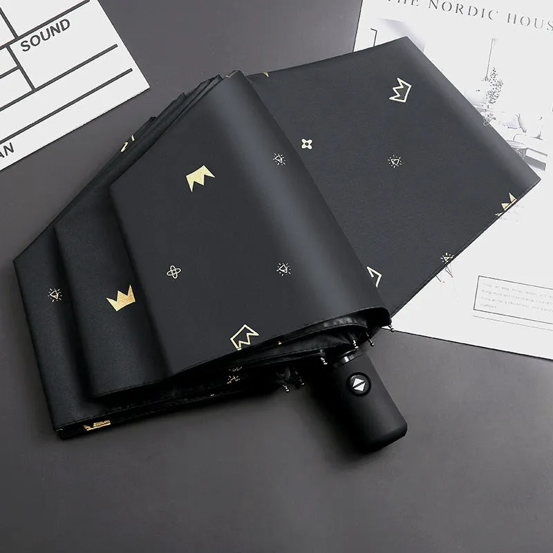 Dual-use automatic eight-bone bronzing feather folding umbrella with black rubber handle and NC fabric canopy