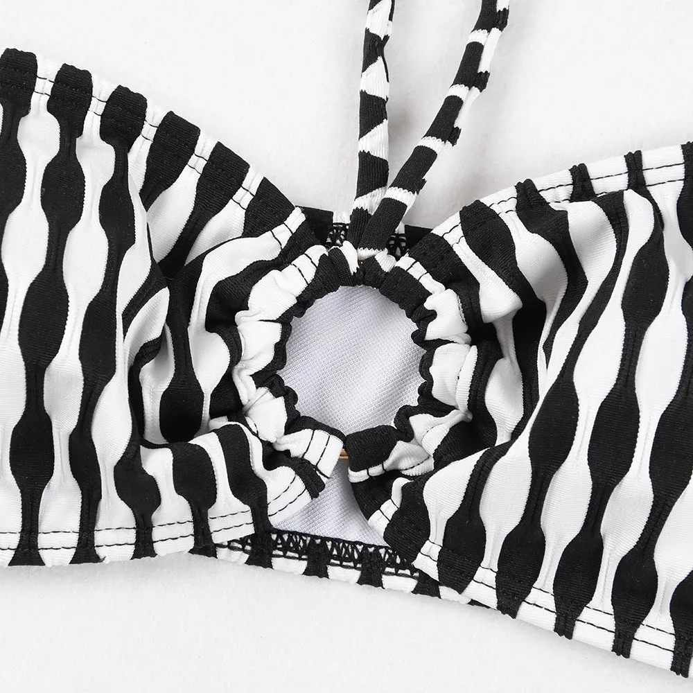 Women's striped three-piece swimsuit set with tube top, shorts, and waist skirt hem