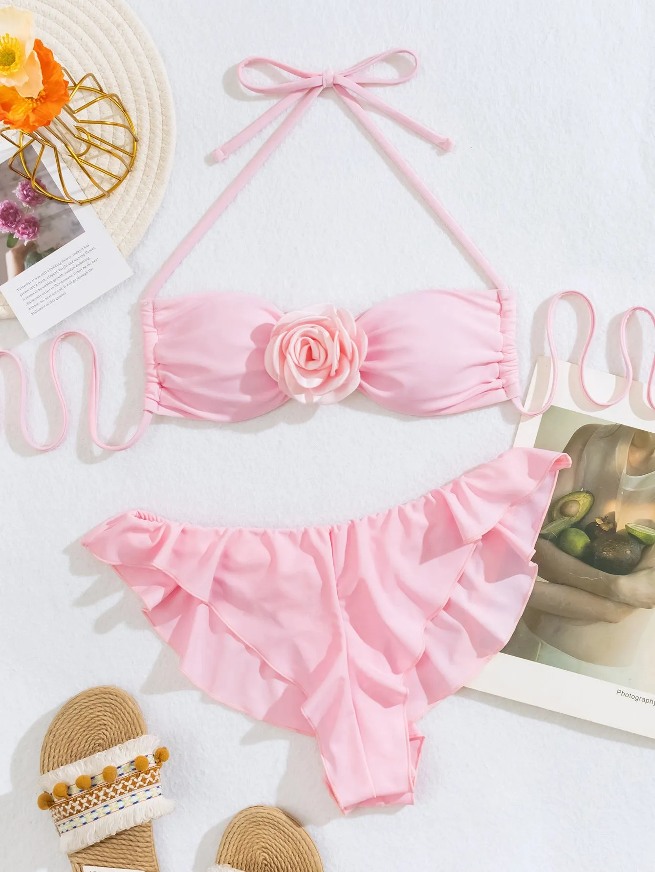 Women's pink nylon bikini set with three-dimensional flower detail on front, top and briefs pants