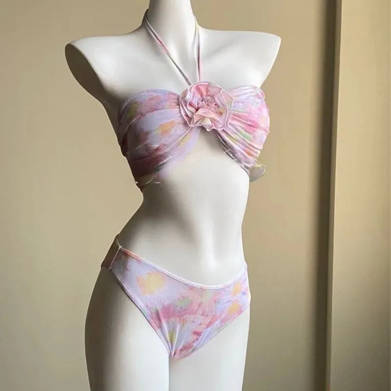 Women's floral split skirt-style swimsuit bikini three-piece set in pink with top, skirt, and panties