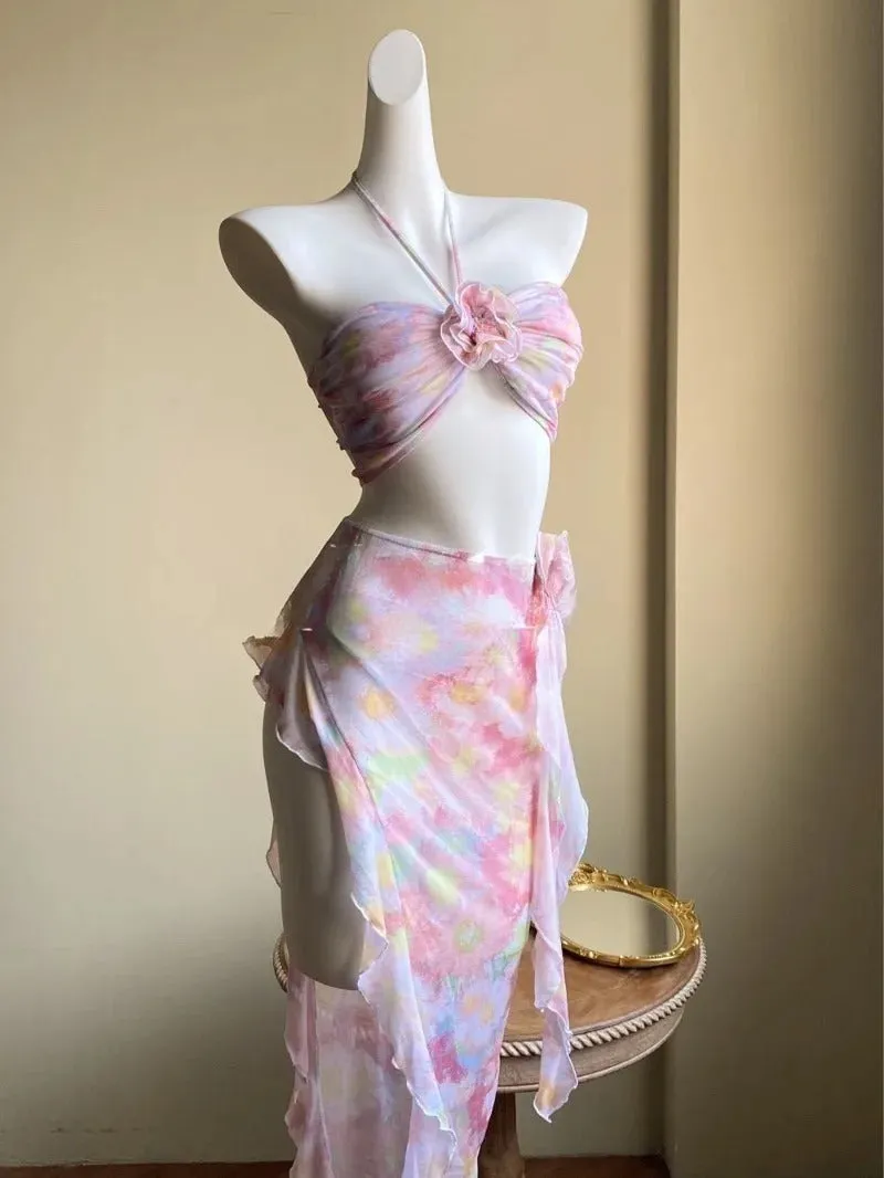 Women's floral split skirt-style swimsuit bikini three-piece set in pink with top, skirt, and panties