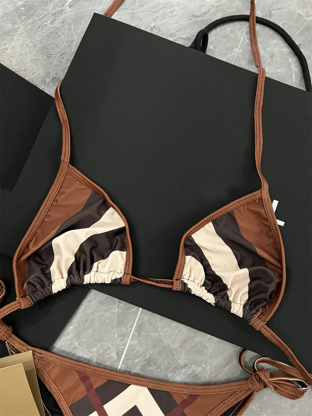 Women's black and white floral bikini set made from polyester fibre, available in sizes S M L XL