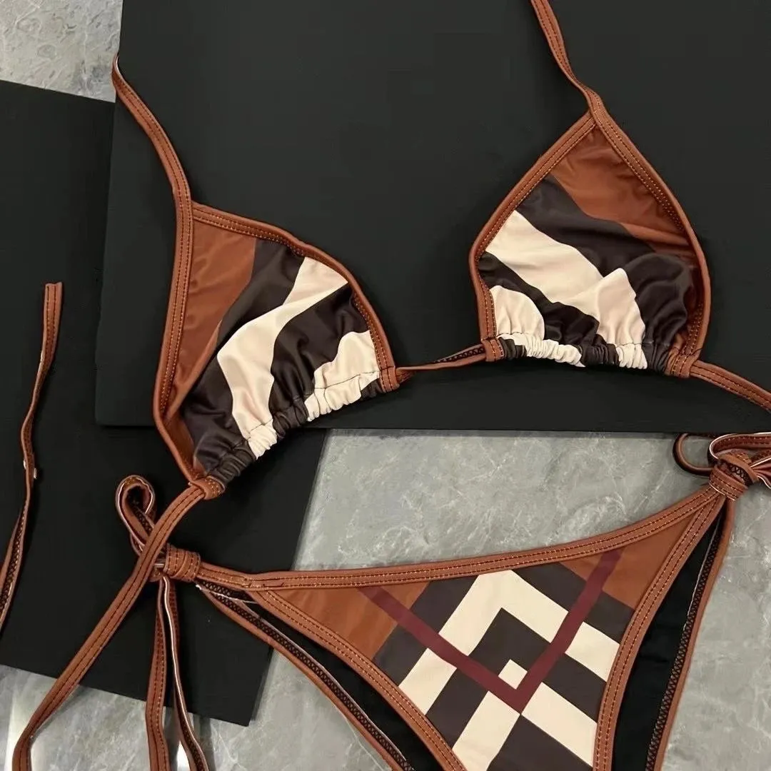 Women's black and white floral bikini set made from polyester fibre, available in sizes S M L XL