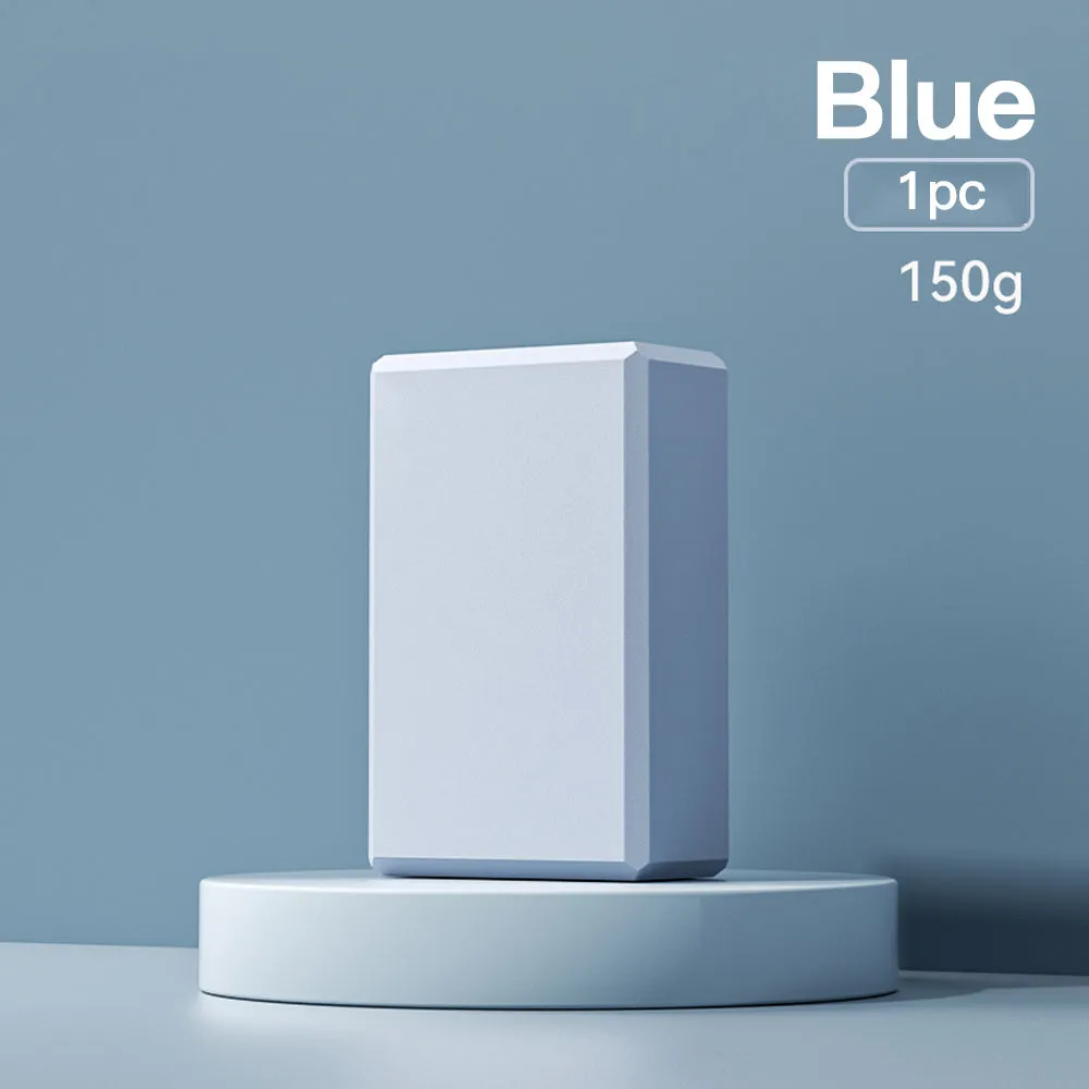 Blue high-density EVA yoga block with hexagonal sides and cut ridges for grip