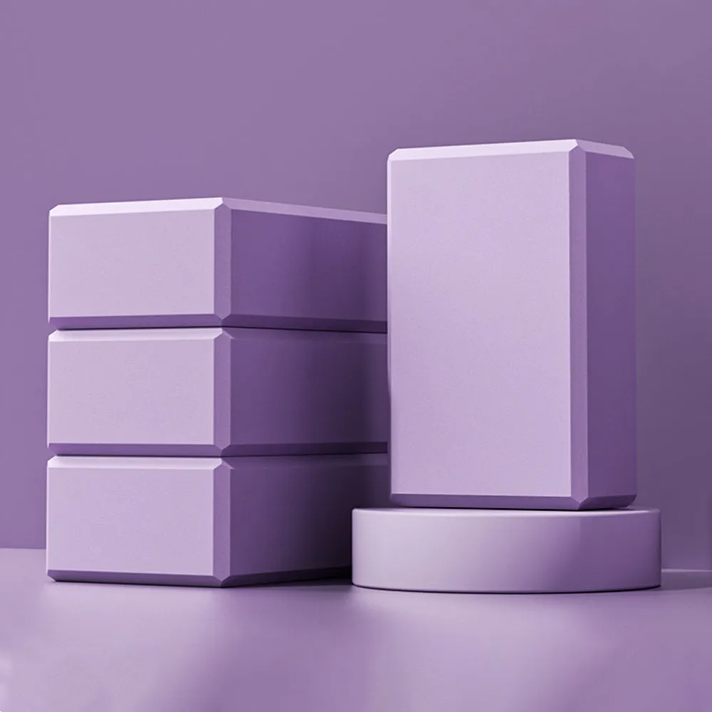 Blue high-density EVA yoga block with hexagonal sides and cut ridges for grip