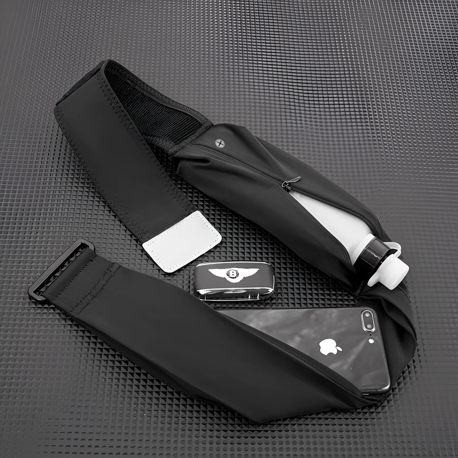 Women's running cell phone belt bag in black with 330ml kettle, adjustable waistband, nylon construction