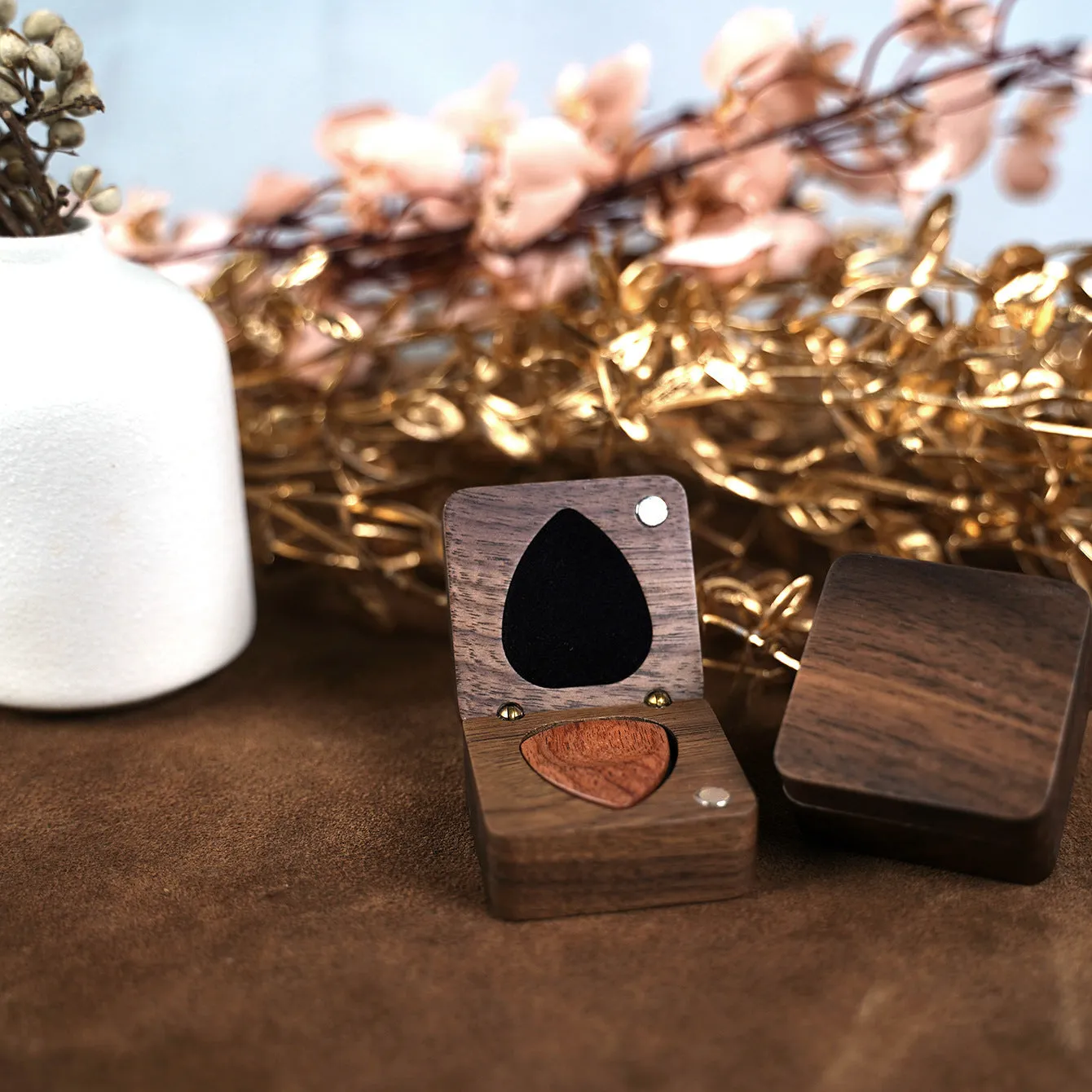 Wooden guitar pick box storage container made from Sapele wood with a brown finish