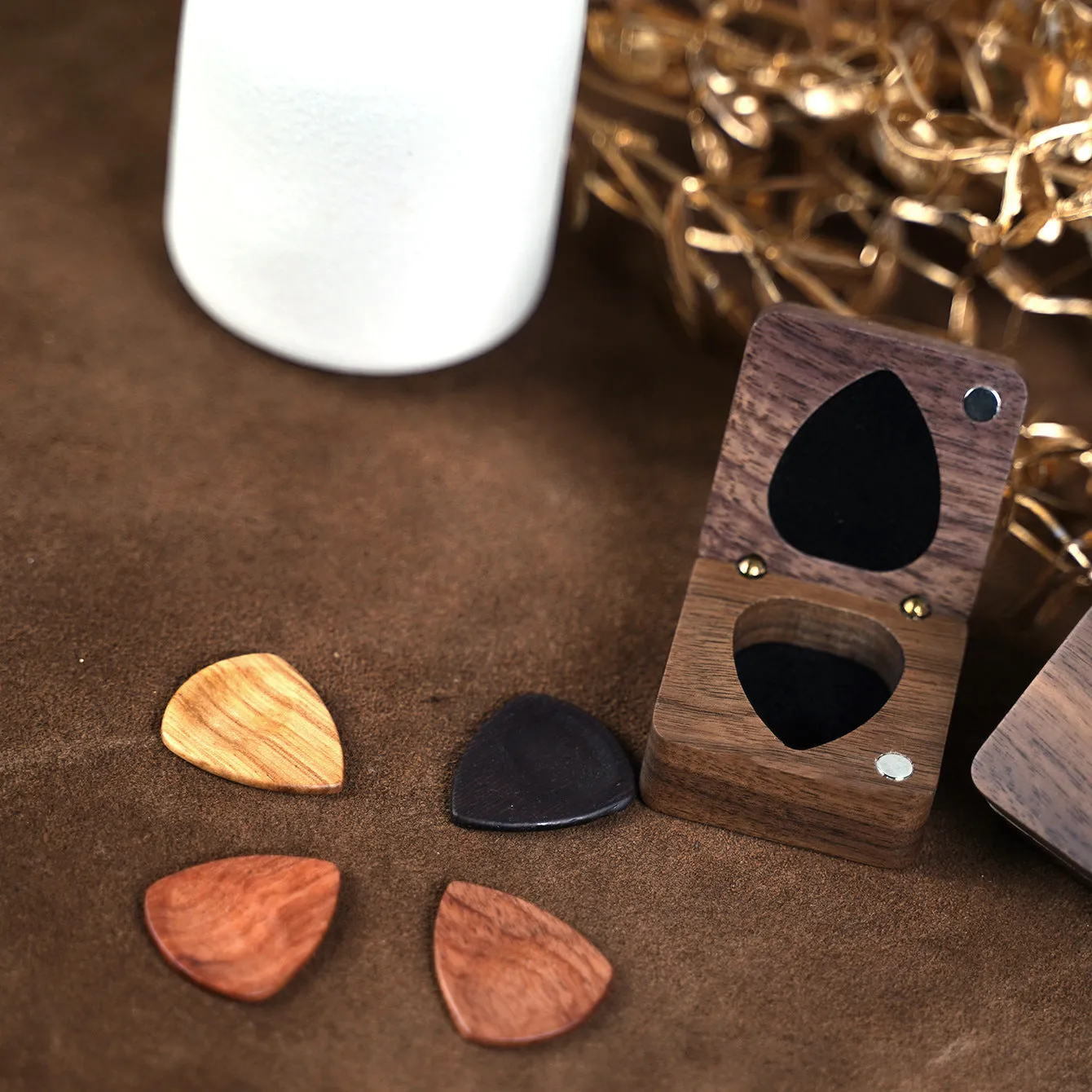 Wooden guitar pick box storage container made from Sapele wood with a brown finish