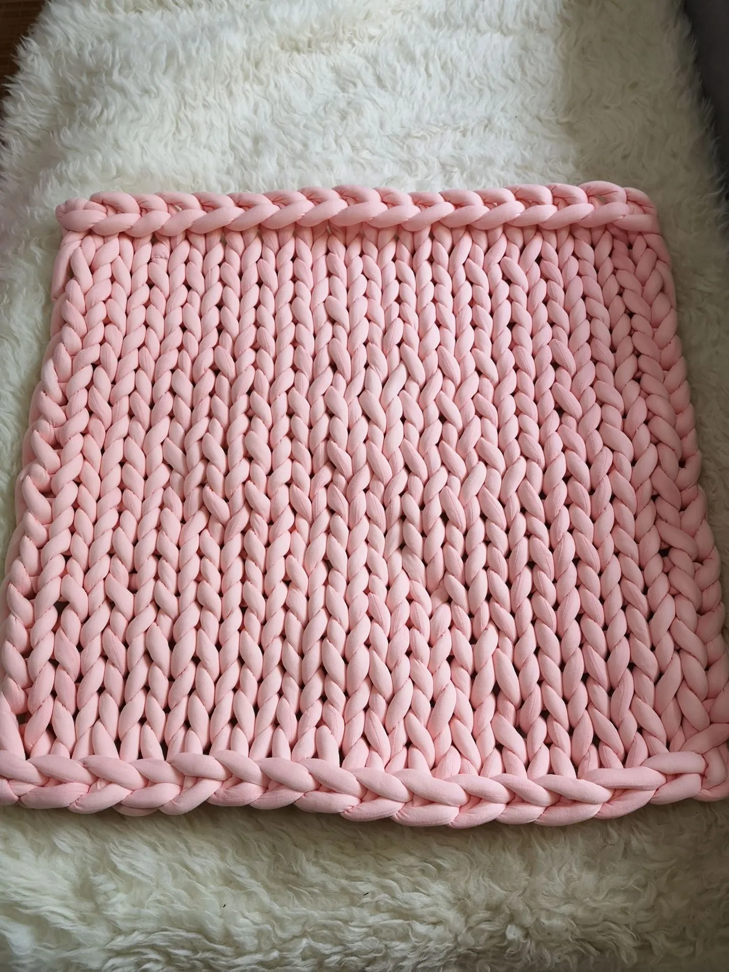 Hand-woven chenille polyester weighted blanket in beige solid colour, 200x200cm size on a bed.