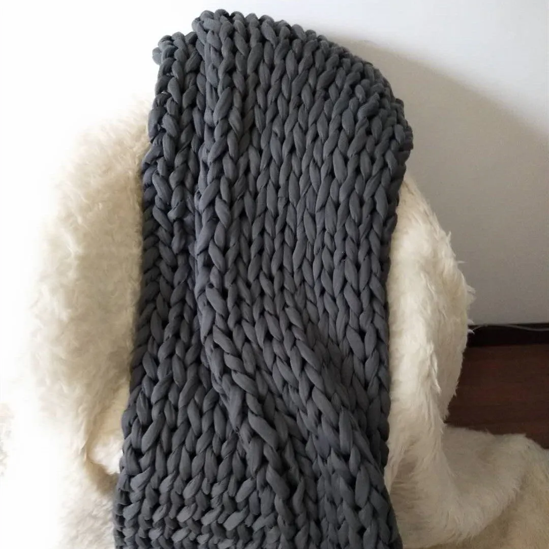 Hand-woven chenille polyester weighted blanket in beige solid colour, 200x200cm size on a bed.