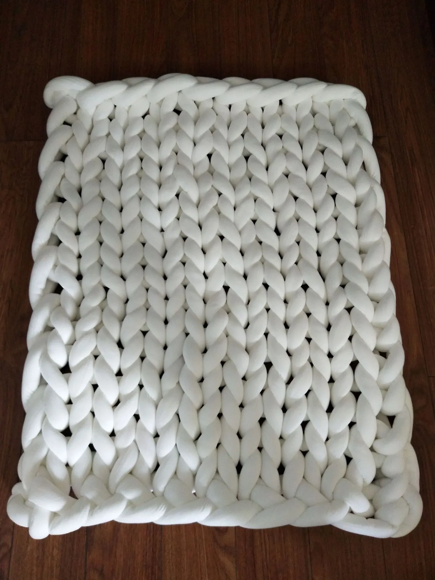Hand-woven chenille polyester weighted blanket in beige solid colour, 200x200cm size on a bed.