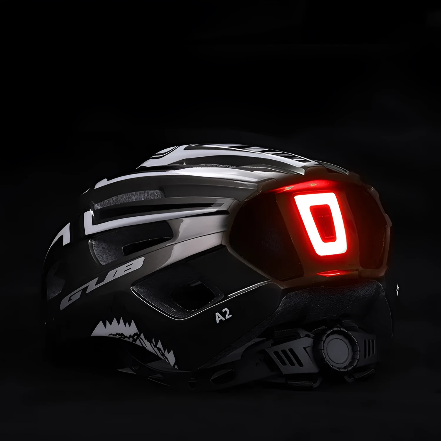 Bright titanium cycling helmet with integrated USB rechargeable taillight and 19 ventilation holes on side view