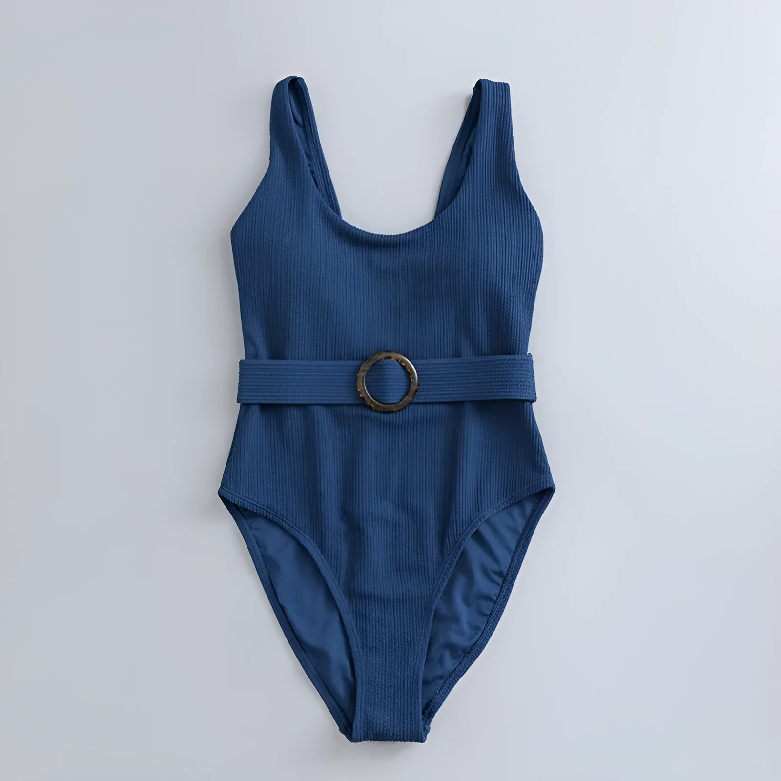 Navy blue one-piece women's swimsuit with a triangle neckline and slimming fit on a mannequin.