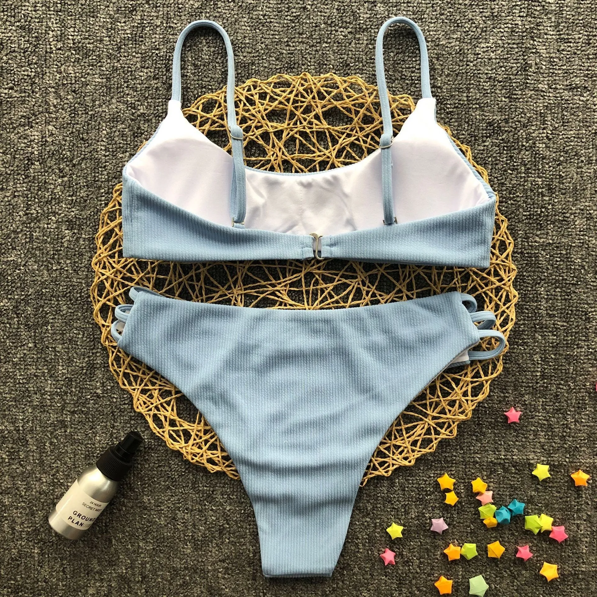 Blue striped bikini set with polyester and nylon fabric, two-piece swimwear on display