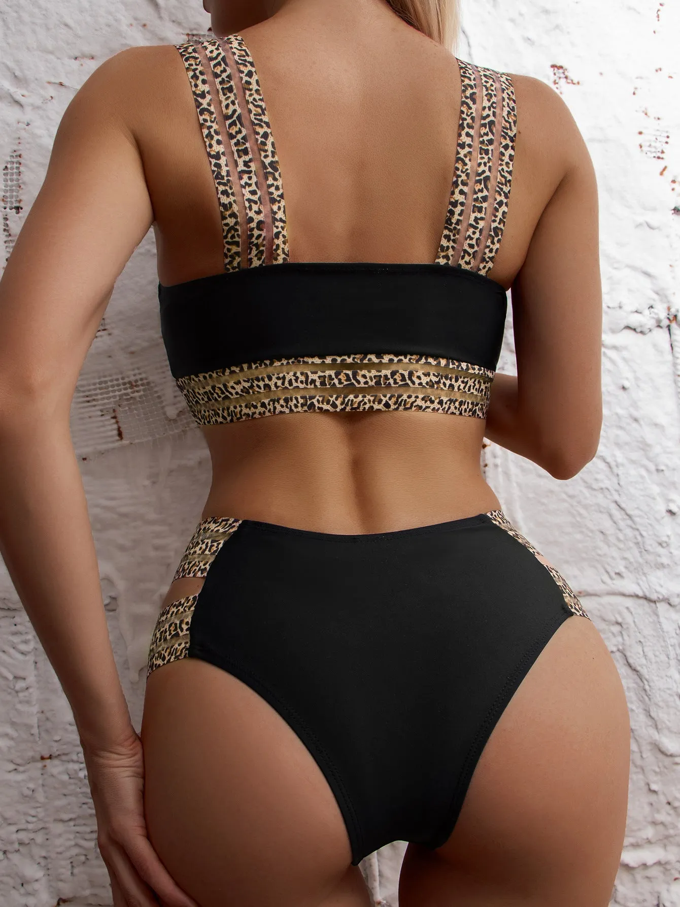 Women's black nylon bikini set with leopard ribbon trim and steel support chest pads for swimming and body building