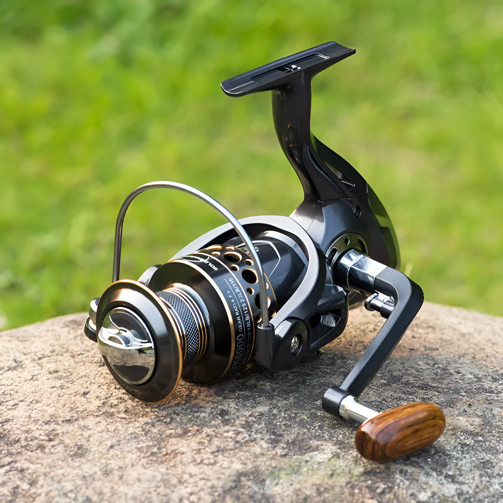 Telescopic fishing rod combo with carbon fibre rod and spinning reel with solid wood handle on a beach