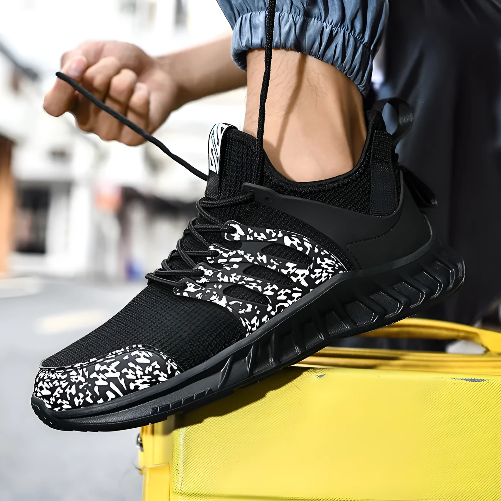 Flying woven mesh sneakers black side view showing lightweight plush upper and rubber sole