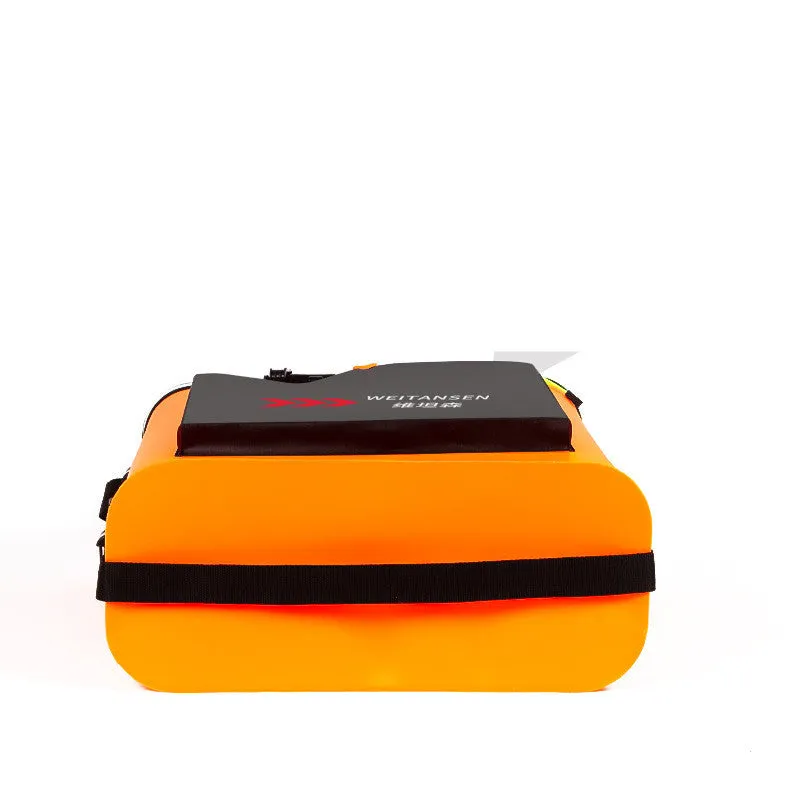 Foldable blue EVA fishing box live fish bucket measuring 42x42x21cm on a grassy bank