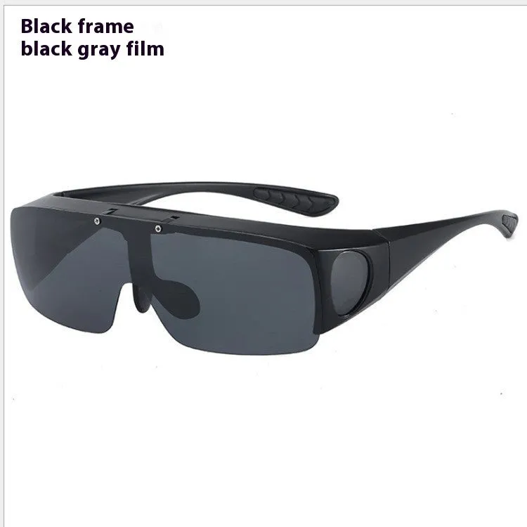 One-piece polarised sunglasses with myopia correction and multiple interchangeable coloured lens sheets laid out.