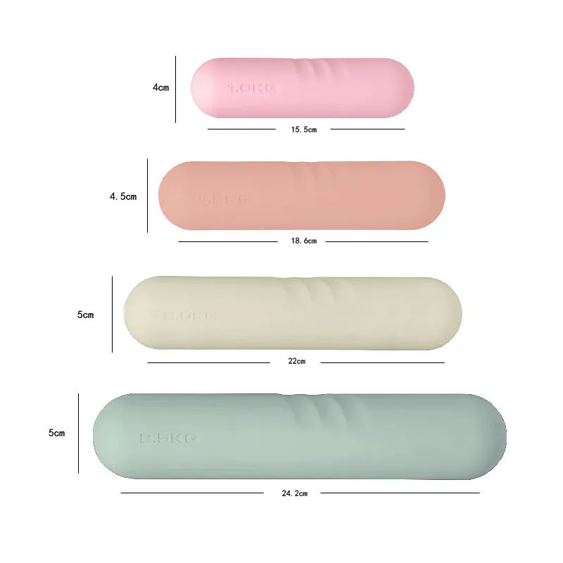 Silicone non-slip edging on a hand-drawn cast iron dumbbell stick in various colours and weights.