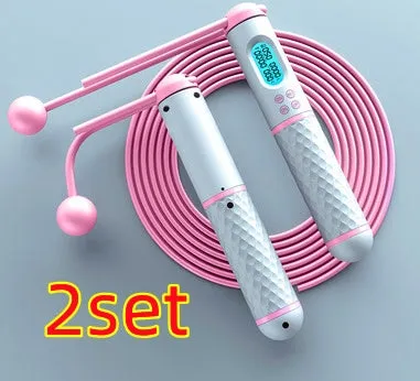 Intelligent counting skipping rope with ABS handle and weight-bearing balls on black yellow background