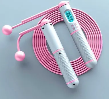 Intelligent counting skipping rope with ABS handle and weight-bearing balls on black yellow background