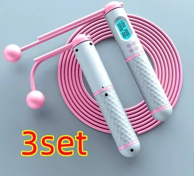Intelligent counting skipping rope with ABS handle and weight-bearing balls on black yellow background