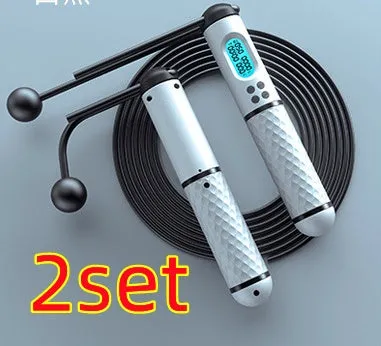Intelligent counting skipping rope with ABS handle and weight-bearing balls on black yellow background