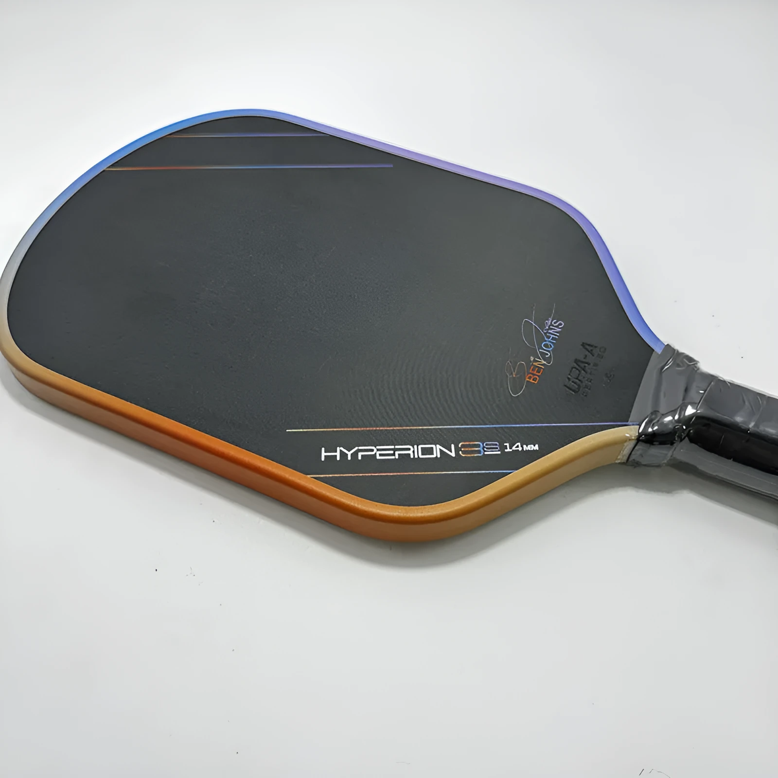 Colour pattern matte finish pickleball racket with T700 carbon fiber construction and honeycomb core.